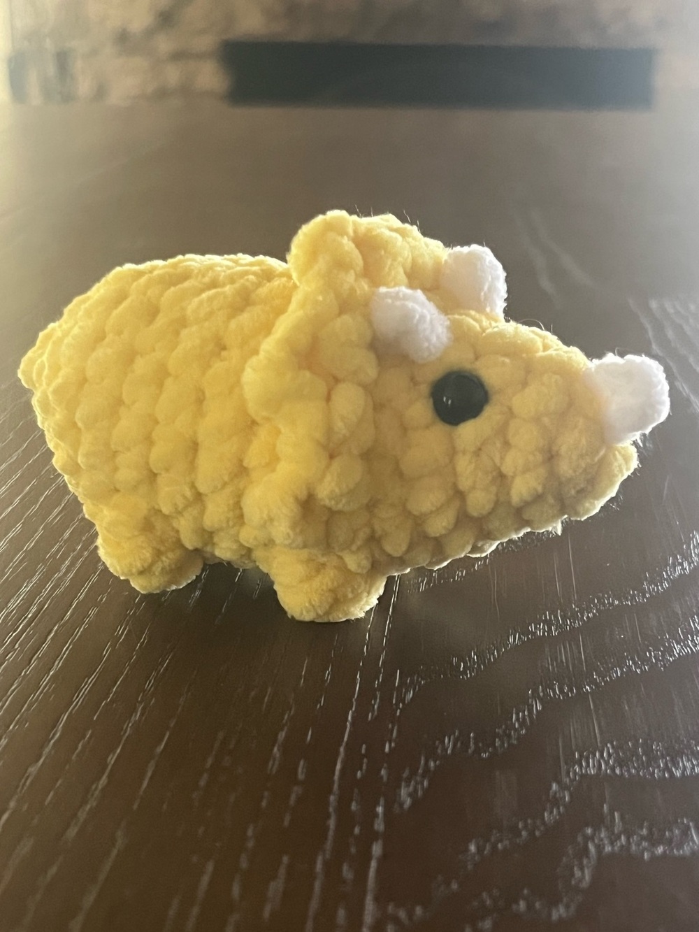 Crocheted baby triceratops dinosaur